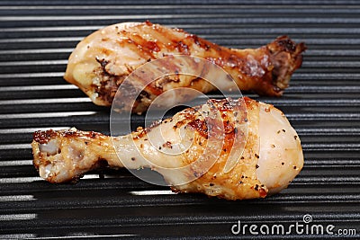 Chicken drumstick on grill Stock Photo