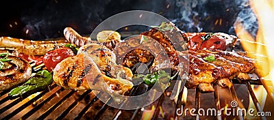 Chicken drumsticks, pork ribs and sausage on a BBQ Stock Photo