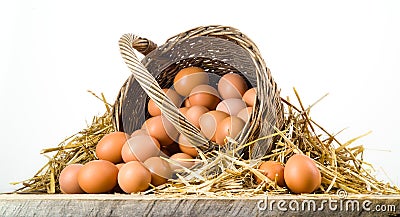 Chicken eggs in basket isolated. Organic food Stock Photo