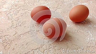 Chicken eggs on spotted textured background Stock Photo