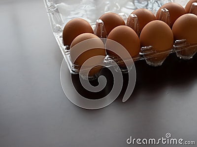 Chicken eggs stock at home, isolate wooden dark background Stock Photo