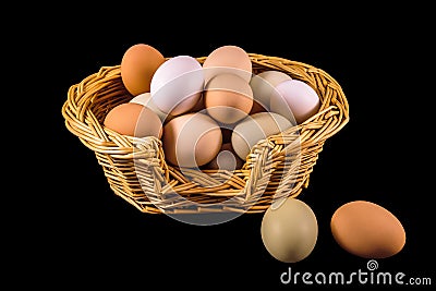 Chicken Eggs in a Wicker Basket Stock Photo