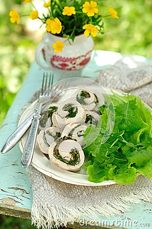 Chicken fillet rolls with fresh greens served with salad leaves, copy space for your text Stock Photo