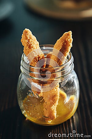 Chicken finger with mustard sauce in a glass bowl Stock Photo