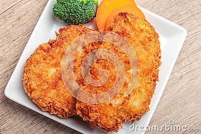 Chicken fried steak with vegetables, pancakes with garlic and herbs Stock Photo