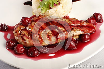 Chicken grill with rice and cherry sauce Stock Photo