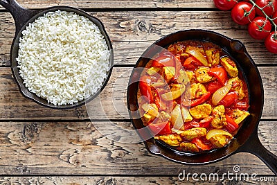 Chicken jalfrezi dietetic traditional Indian curry spicy fried meat with vegetables and basmati rice food Stock Photo