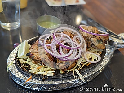 Chicken kebab hot plate sizzle Stock Photo