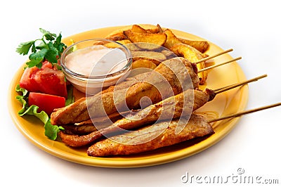 The chicken kebab on skewers with vegetables Stock Photo