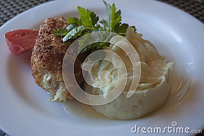 Chicken Kiev with parsley and potato puree Stock Photo