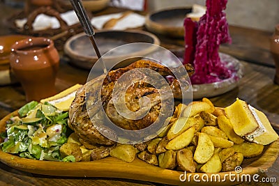 chicken meal in medieval tavern, Hungary Stock Photo