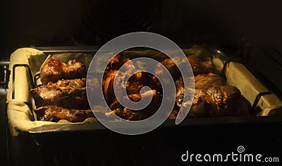 Chicken meat is baked in oven process cooking Stock Photo