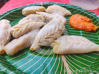 Chicken Momos with spicy chutni, viewed up close Stuffed filling dumplings Stock Photo