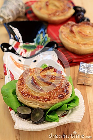 Chicken and mushroom pie on wooden table in restaurant Stock Photo