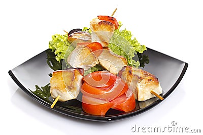 Chicken pieces grilled on skewers isolated Stock Photo