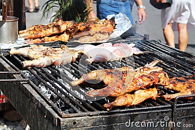 Chicken portions on smoking grill, street food Stock Photo