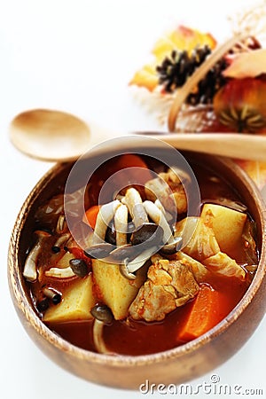 Chicken red soup and mushroom curry in white bowl Stock Photo