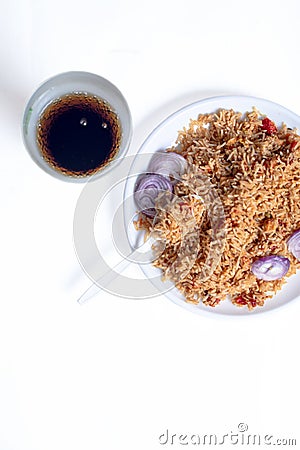 Chicken rice and coke or pepsi cool drink isolated on a white background. overhead view Stock Photo