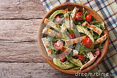 Chicken salad with avocado, arugula and tomatoes. horizontal top Stock Photo