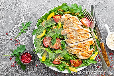 Chicken salad. Meat salad with fresh tomato, sweet pepper, arugula and grilled chicken breast. Chicken fillet with fresh vegetable Stock Photo