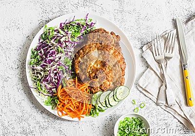 Chicken schnitzel tempura, red and white cabbage coleslaw and spicy pickled carrots on a light background, top view. Stock Photo