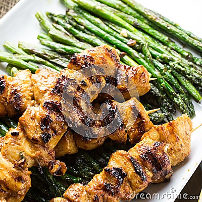 Chicken skewers with green asparagus Stock Photo