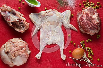 Poultry preparing for cooking on red board Stock Photo