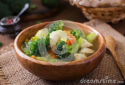 Chicken soup with broccoli, green peas, carrots and celery Stock Photo