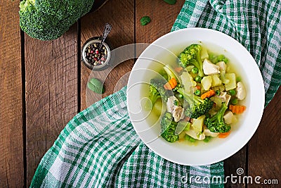 Chicken soup with broccoli, green peas, carrots and celery Stock Photo