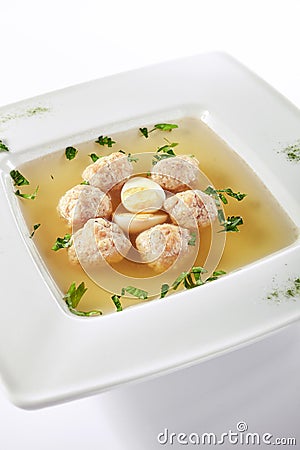 Chicken Soup with Meatballs Decorated with Boiled Quail Egg Stock Photo