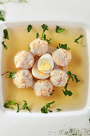 Chicken Soup with Meatballs Decorated with Boiled Quail Egg Stock Photo