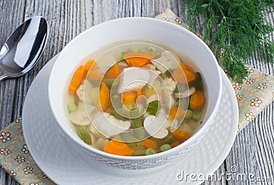 Chicken soup with vegetables and mushrooms Stock Photo