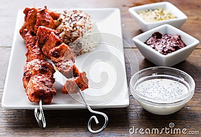 Chicken tandoori skewers with sauces Stock Photo