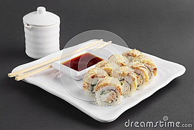 Chicken teriyaki roll with chopsticks and soy sauce Stock Photo