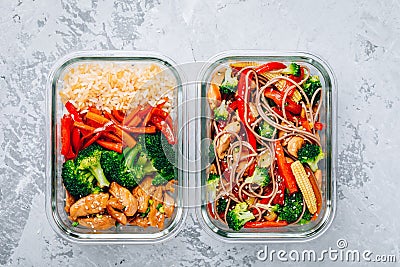 Chicken teriyaki stir fry meal prep containers with broccoli, carrots, rice or soba noodles Stock Photo
