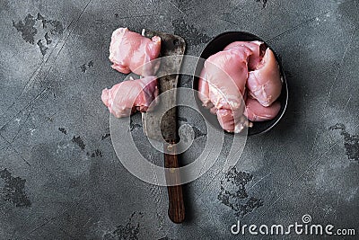 Chicken thighs on grey backgroundtop viewwith space for text Stock Photo