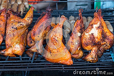 Chicken thighs and a half lamb on barbecue Stock Photo