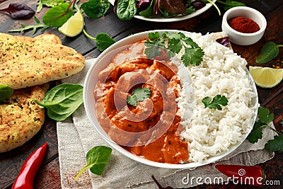 Chicken tikka masala curry with rice and naan bread Stock Photo