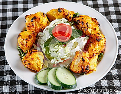 Chicken tikka with salad in plate Stock Photo
