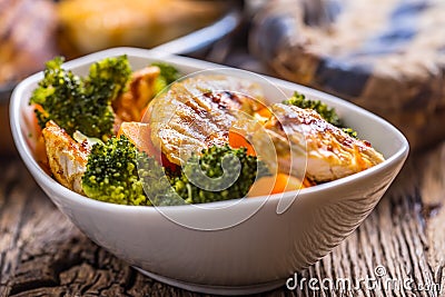 Chicken and vegetable salad. Pieces of grilled chicken with carrots and broccoli Stock Photo