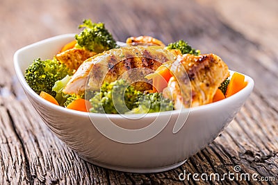 Chicken and vegetable salad. Pieces of grilled chicken with carrots and broccoli Stock Photo