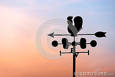Chicken wind vane with compass and sky Stock Photo
