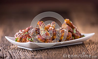 Chicken wings. Fried chicken wings in white bowl garlic dressing ketchup and potato fries Stock Photo