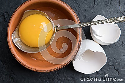 Chicken yolk from broken organic egg Stock Photo