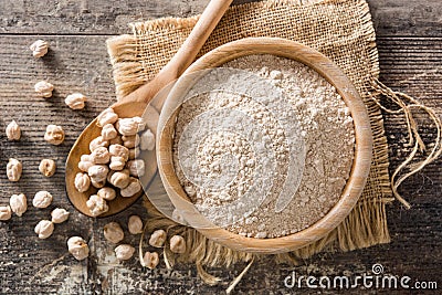 Chickpea flour on wooden table Stock Photo