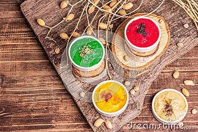 Chickpea hummus backdrop, assorted flavor on vintage wooden table Stock Photo