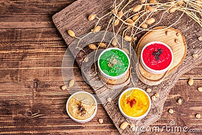 Chickpea hummus backdrop, assorted flavor on vintage wooden table Stock Photo