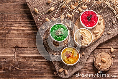 Chickpea hummus backdrop, assorted flavor on vintage wooden table Stock Photo