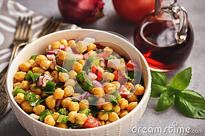 Chickpea salad with green pepper, red onion and vinaigrette dressing. Stock Photo