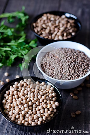 Chickpeas, beans and lentils in bowls Stock Photo